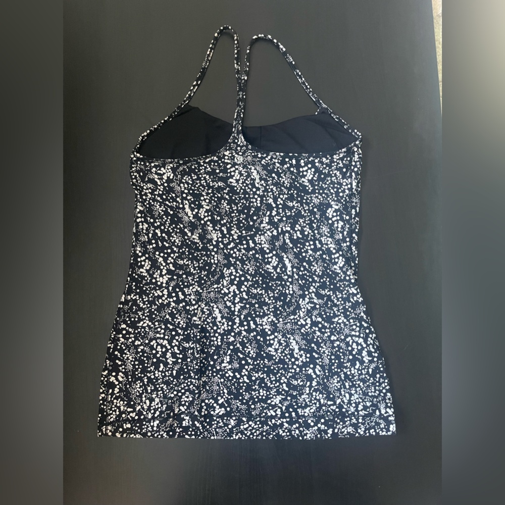 Lululemon tank top with black under bra, with white spots as the design
